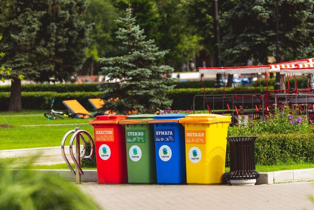 Four recycling garbage bins that sort waste in each container for residual waste, paper, plastic and bottle